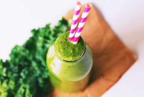 selective focus photography of vegetable shake on brown wood board
